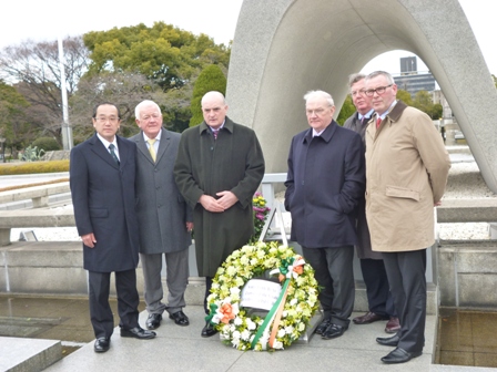 Chairman Burke (in the middle) in front of the Cenotaph