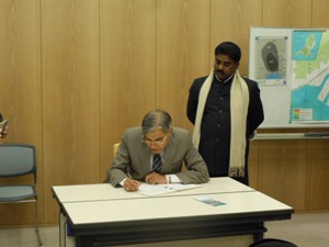 Indian Minister writing a message 